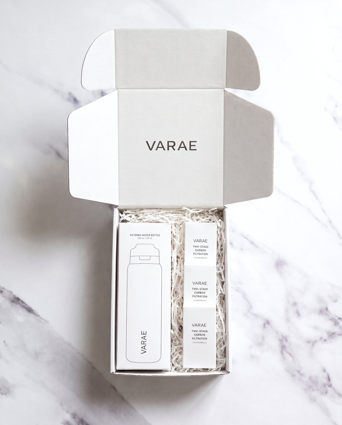 VARAE Gift Set, open white gift box with a bottle carton and three filter refill packs
