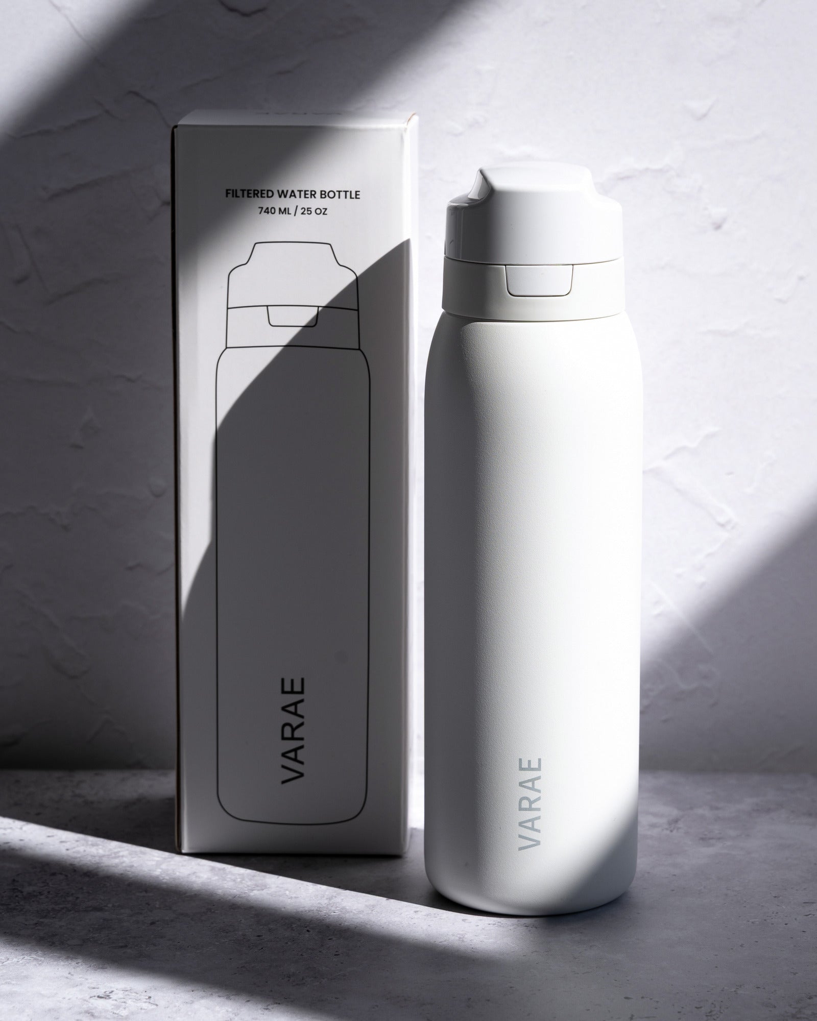 The VARAE Pure bottle beside its retail box.