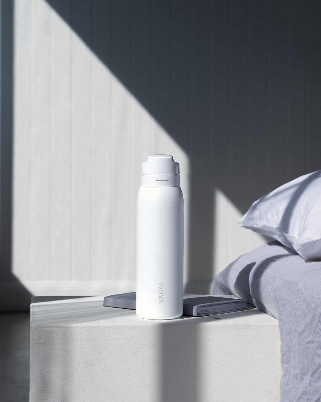 VARAE Pure bottle on a bedside table.
