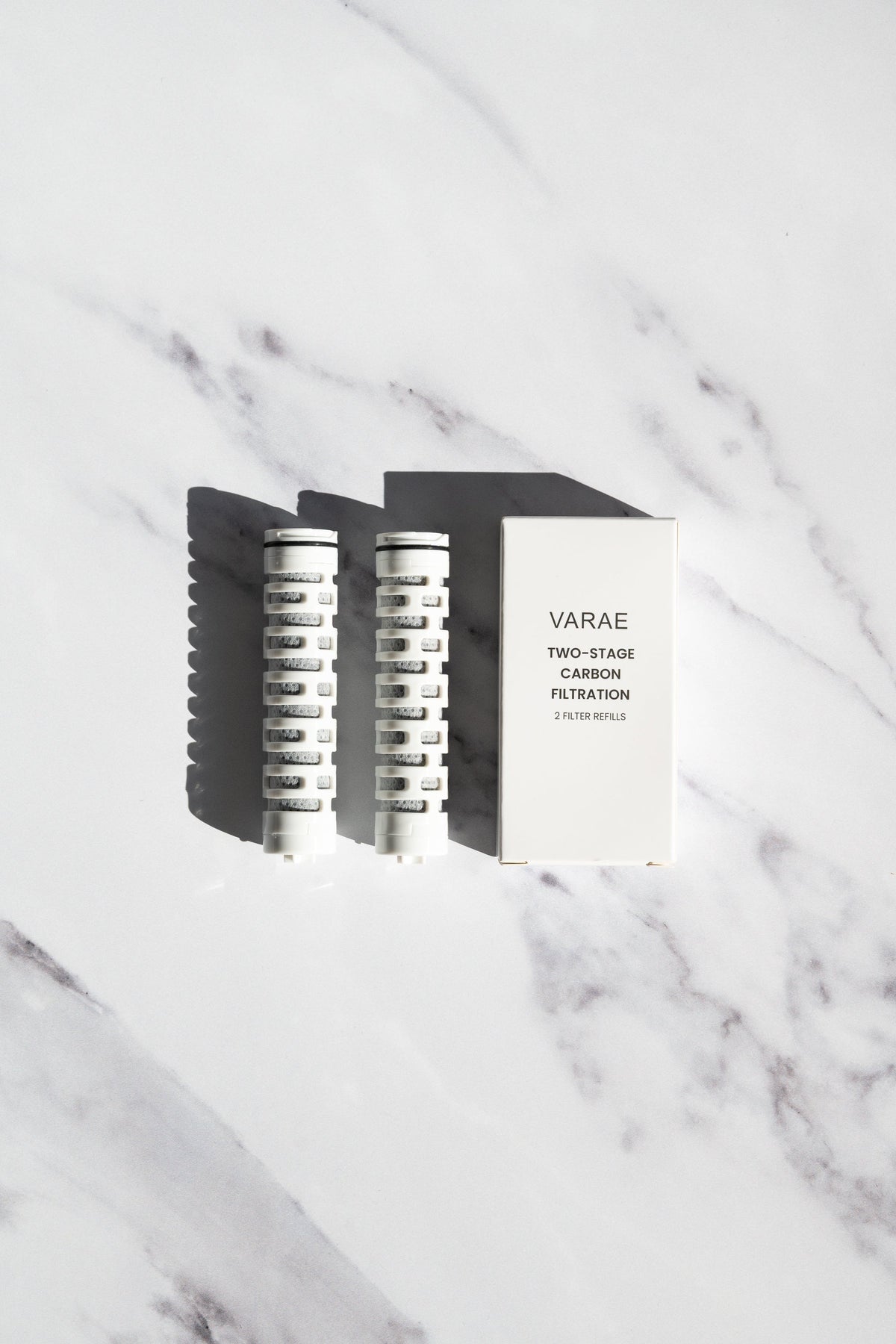 VARAE Filter Year Pack, replacement filter cartridges beside their box on a marble surface
